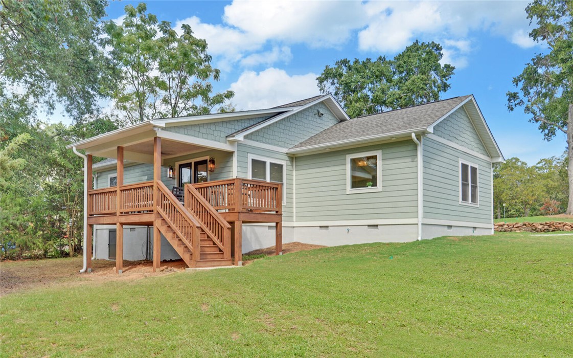398 Hidden Point Road Hartwell, GA 30643 - Photo 26 of 46 This charming home offers a spacious deck and ample yard space for outdoor enjoyment.