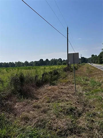 a swimming pool with some trees in the background