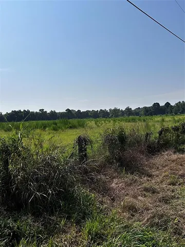 a view of a lake with houses in the back