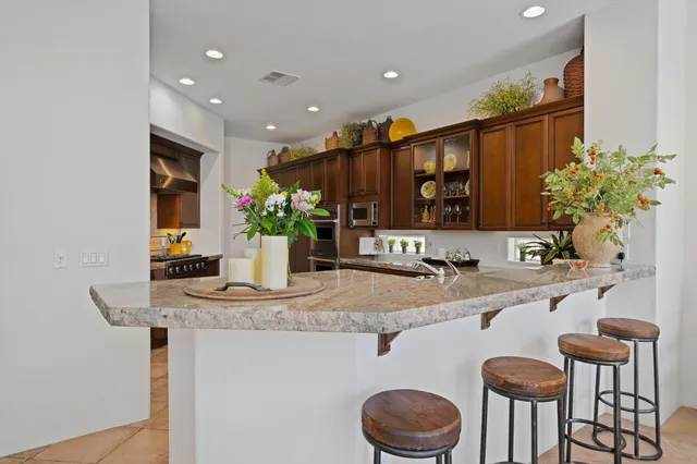 a kitchen with stainless steel appliances a sink and a stove