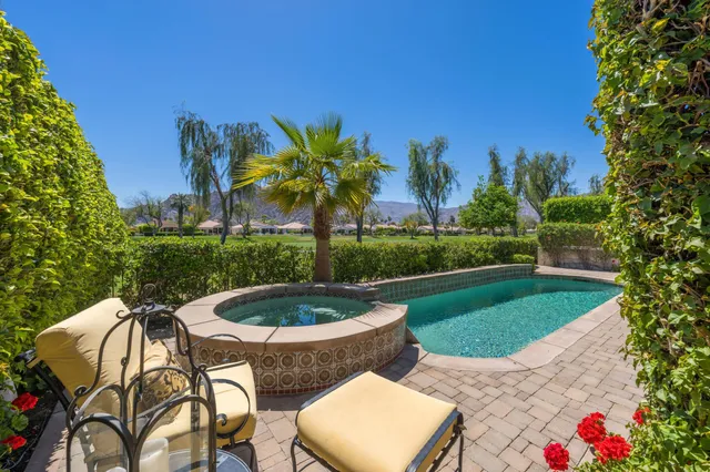 a view of a swimming pool with a patio