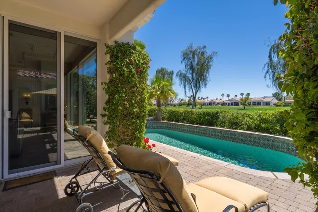 a bedroom with a bed and large window
