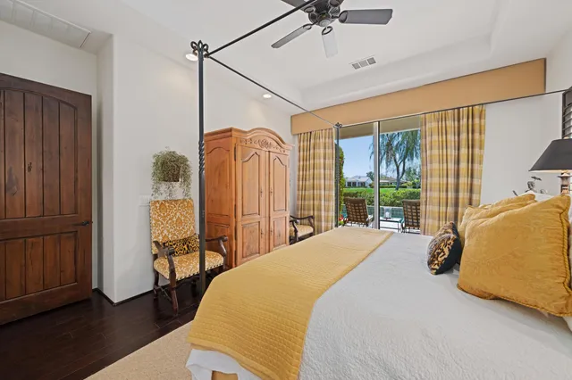 a spacious bathroom with a granite countertop sink and a large mirror