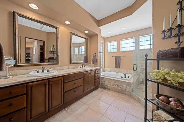 a bathroom with a bathtub and shower