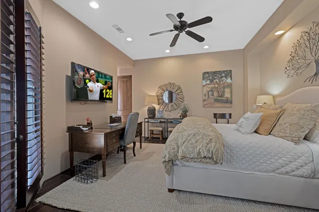 a bedroom with a bed and a table