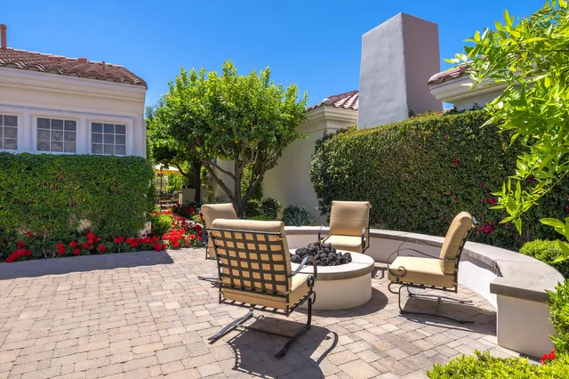 a view of a patio with furniture and a potted plants