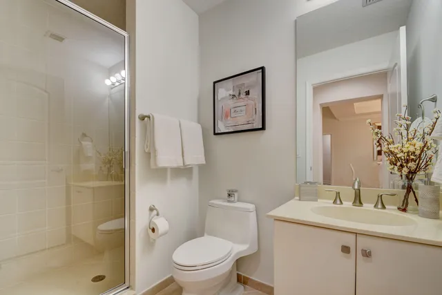 a bathroom with a toilet sink and shower