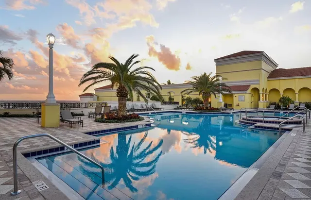 a view of a swimming pool with sitting area
