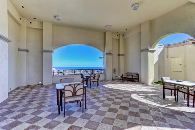 a view of path along with flowers and white house