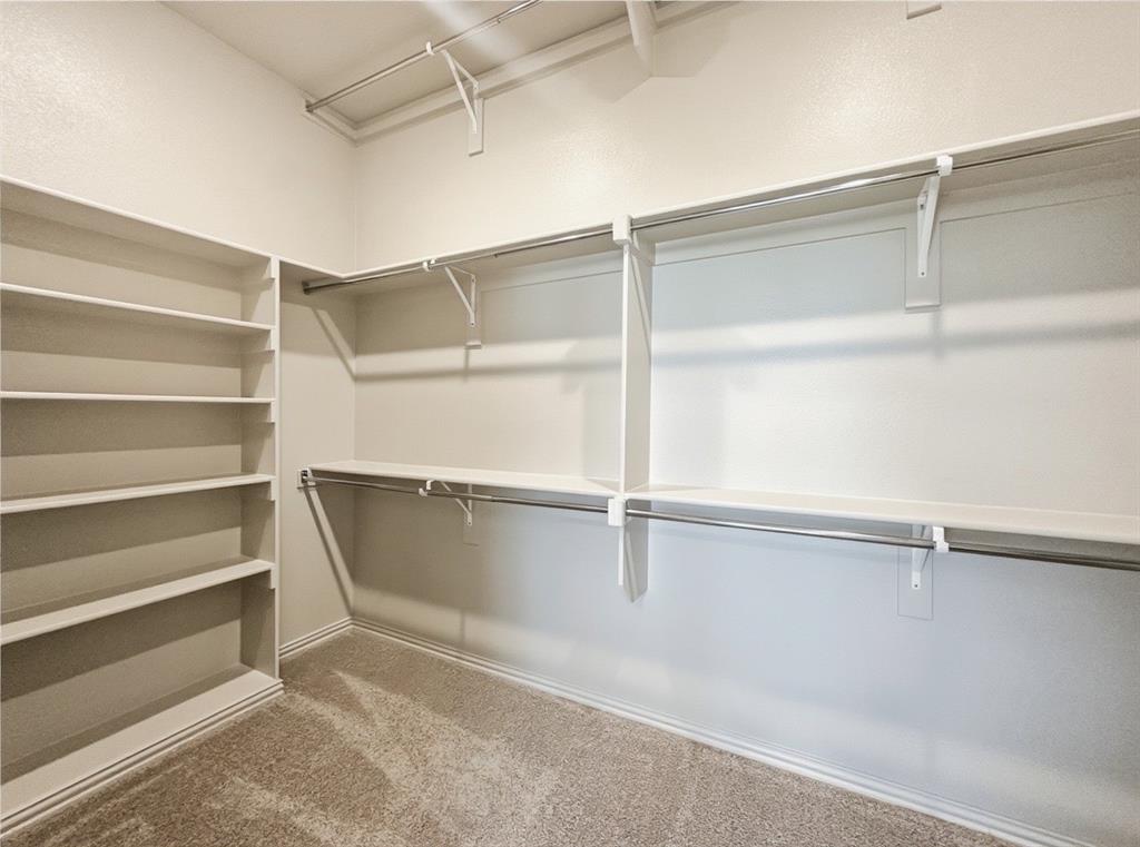 2837 Bluejack Road McKinney, TX 75071 - Photo 24 of 40 a view of an empty walk in closet