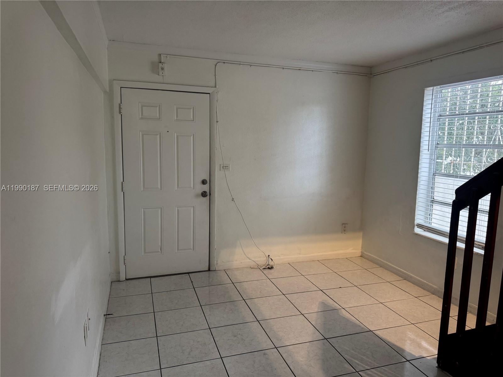 11 Southwest 32nd Avenue, Unit 4 Miami, FL 33135 - Photo 3 of 13 a view of an empty room and window