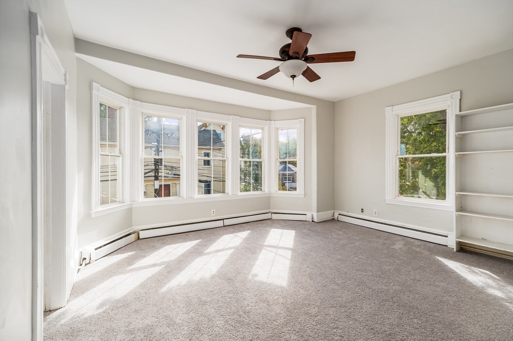 197 East Main Street, Unit 1 & 2 Gloucester, MA 01930 - Photo 12 of 32 a view of an empty room with a window