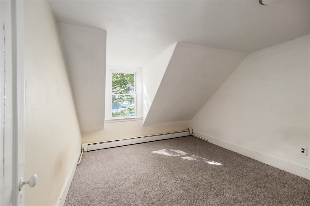 197 East Main Street, Unit 1 & 2 Gloucester, MA 01930 - Photo 24 of 32 an empty room with windows