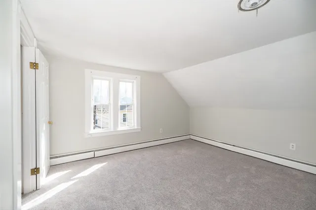 an empty room with a empty space and window