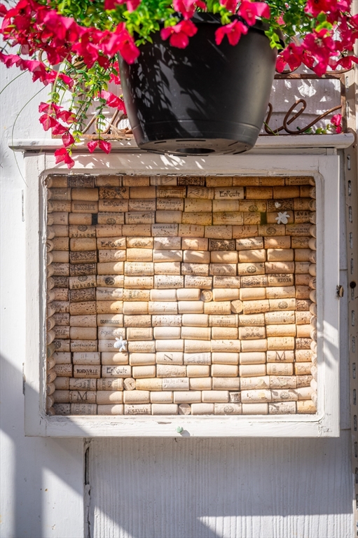 197 East Main Street, Unit 1 & 2 Gloucester, MA 01930 - Photo 31 of 32 a window that has a lot of flowers on it