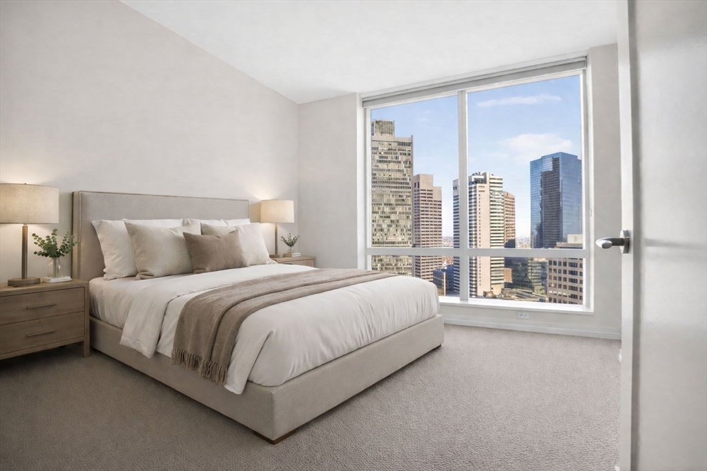 1 Franklin Street, Unit 2805 Boston, MA 02110 - Photo 11 of 22 a bed room with a bed and a large window