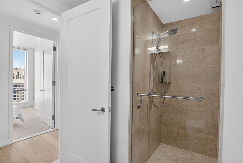 1 Franklin Street, Unit 2805 Boston, MA 02110 - Photo 12 of 22 a bathroom with a glass shower door