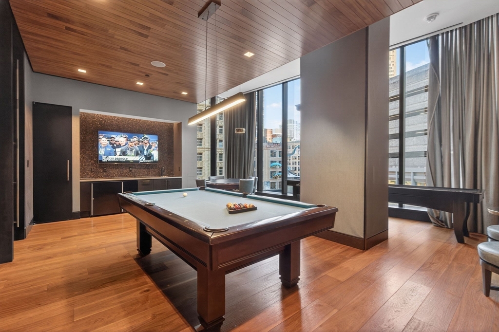 1 Franklin Street, Unit 2805 Boston, MA 02110 - Photo 16 of 22 a room with pool table and windows