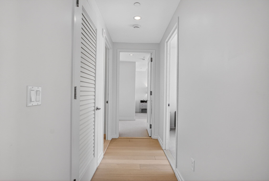 1 Franklin Street, Unit 2805 Boston, MA 02110 - Photo 6 of 22 a view of a hallway with a hallway