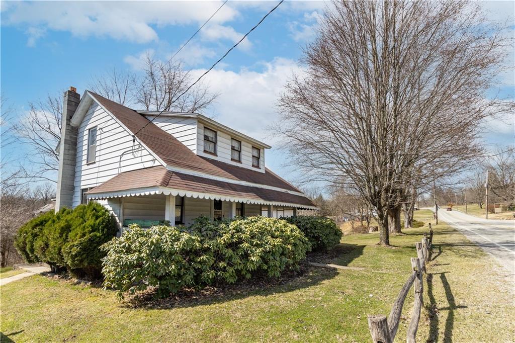 3348-3350 Springfield Pike Normalville, PA 15469 - Photo 17 of 25 a front view of a house with a yard