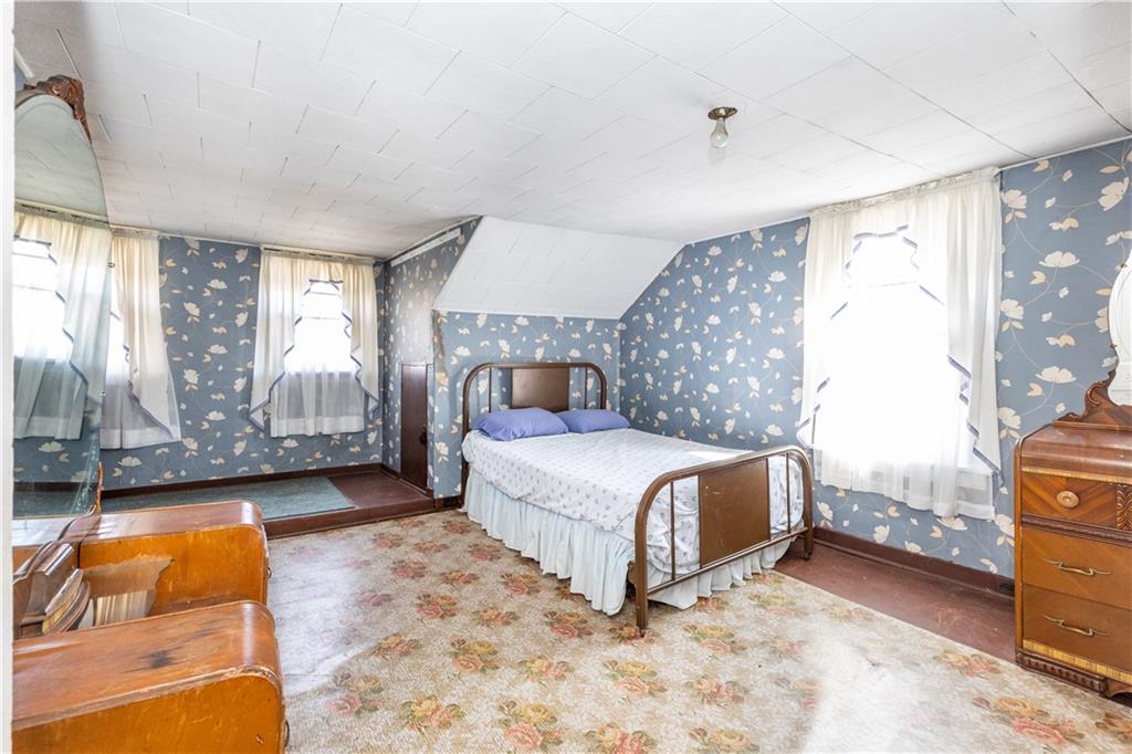3348-3350 Springfield Pike Normalville, PA 15469 - Photo 23 of 25 a spacious bedroom with a bed and a cabinets