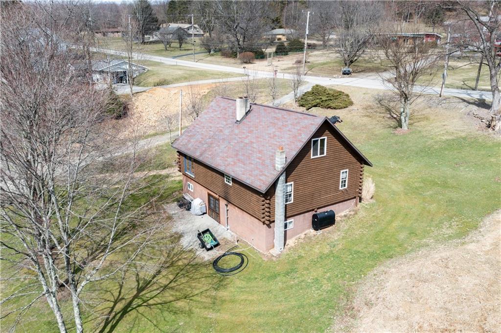 3348-3350 Springfield Pike Normalville, PA 15469 - Photo 3 of 25 a aerial view of a house with swimming pool and sitting area