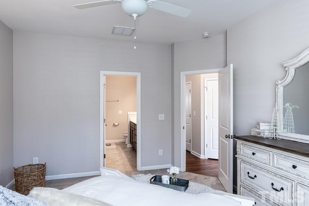 844 Horton Road, Unit 87 Durham, NC 27704 - Photo 11 of 21 a bedroom with a bed and a dresser