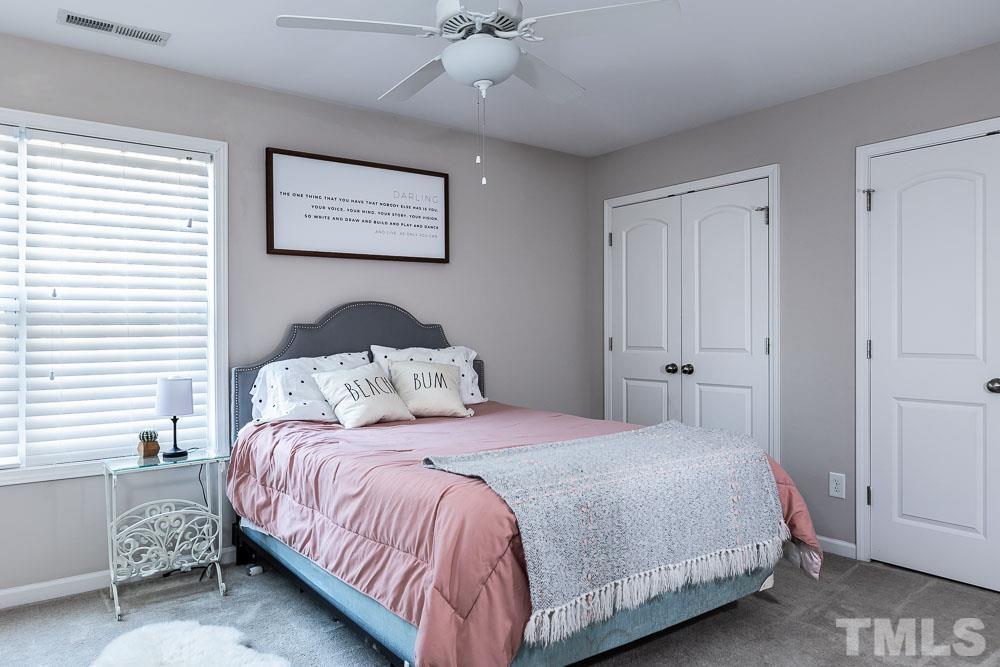 844 Horton Road, Unit 87 Durham, NC 27704 - Photo 15 of 21 a bedroom with a bed and a window