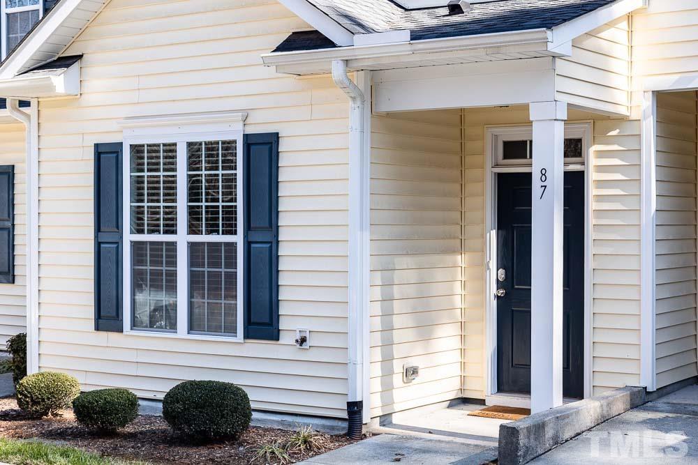 844 Horton Road, Unit 87 Durham, NC 27704 - Photo 2 of 21 a front view of a house with a garage