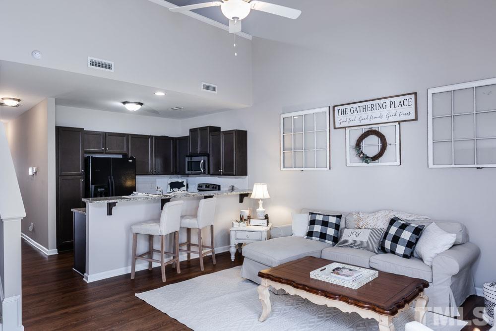 844 Horton Road, Unit 87 Durham, NC 27704 - Photo 7 of 21 a living room with furniture and a table