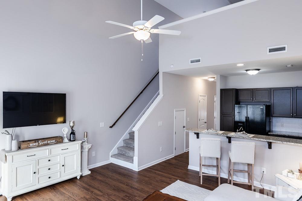 844 Horton Road, Unit 87 Durham, NC 27704 - Photo 9 of 21 a living room with furniture and a flat screen tv