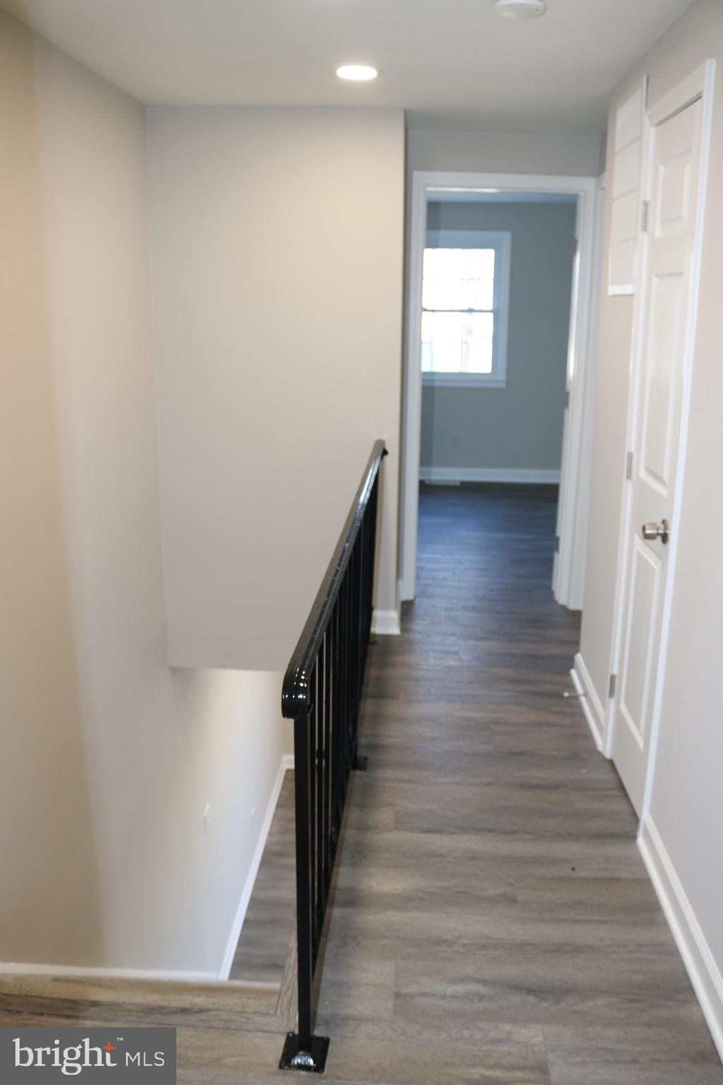 1717 Fort Henry Court Dumfries, VA 22026 - Photo 20 of 27 a view of a hallway with wooden floor and staircase