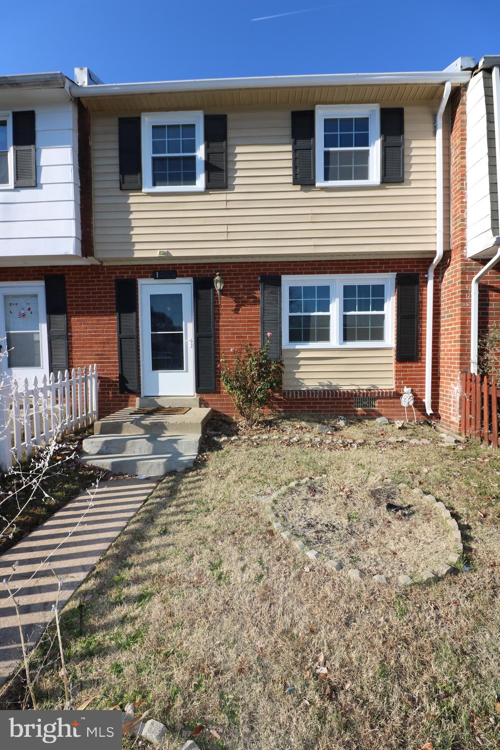 1717 Fort Henry Court Dumfries, VA 22026 - Photo 2 of 27 a front view of a house with a yard