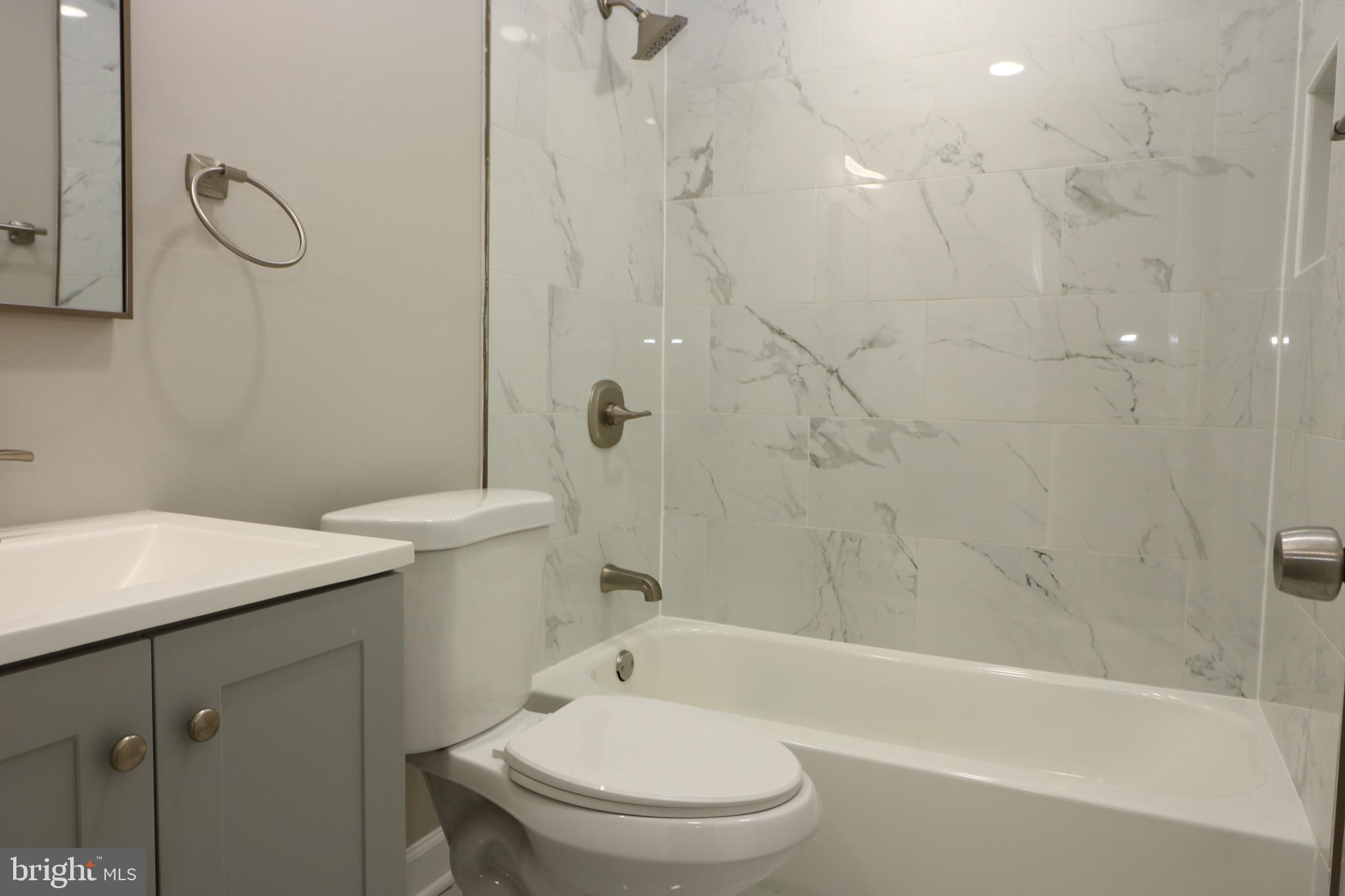 1717 Fort Henry Court Dumfries, VA 22026 - Photo 24 of 27 a bathroom with a sink a toilet and shower