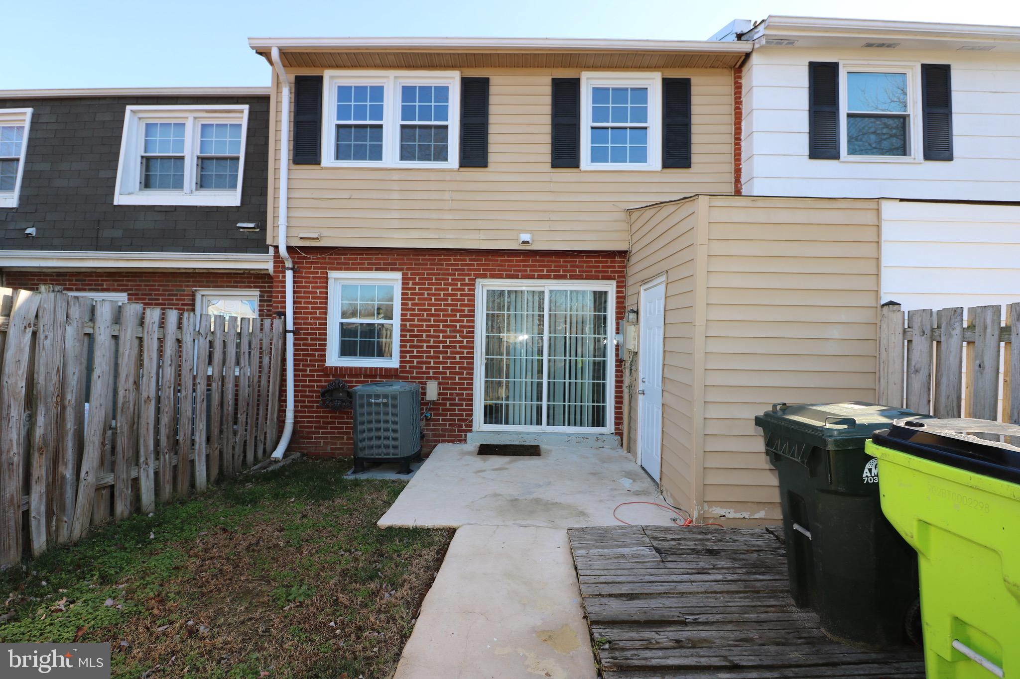 1717 Fort Henry Court Dumfries, VA 22026 - Photo 25 of 27 a front view of a house with garden