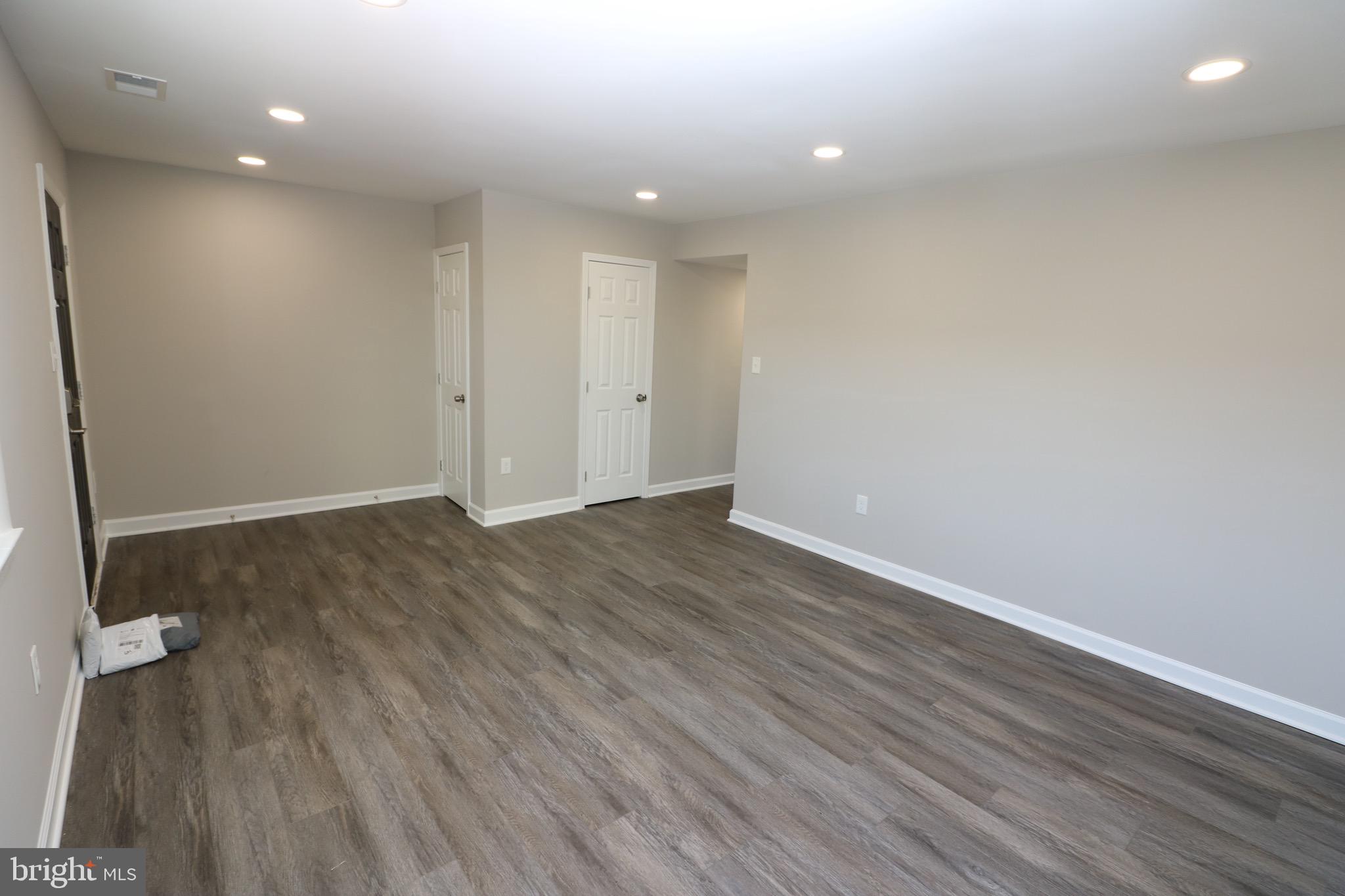 1717 Fort Henry Court Dumfries, VA 22026 - Photo 4 of 27 an empty room with wooden floor and windows