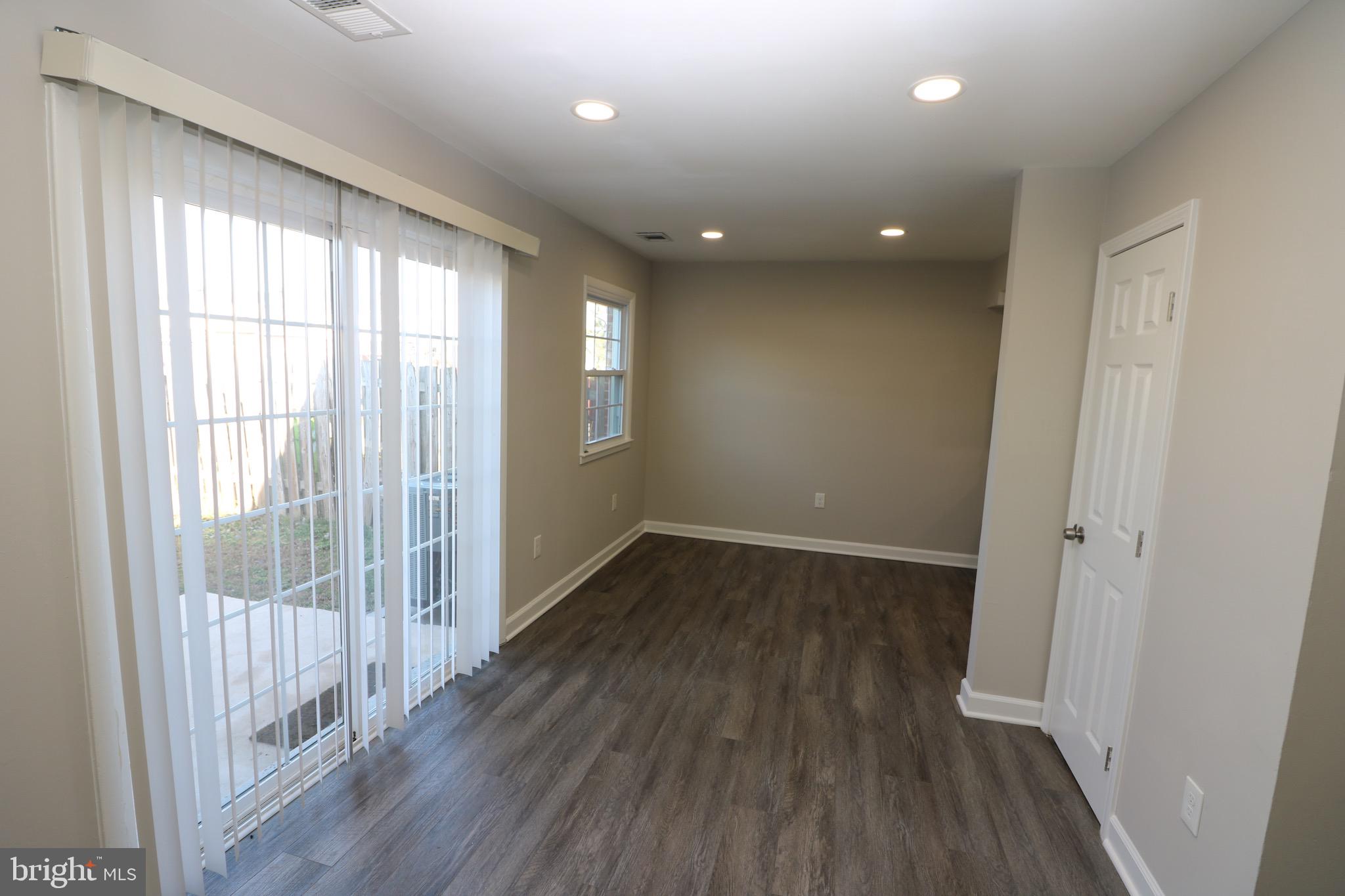 1717 Fort Henry Court Dumfries, VA 22026 - Photo 9 of 27 wooden floor in an empty room with a window
