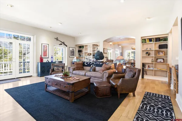 a living room with furniture and a rug