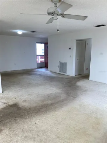 a view of empty room with windows