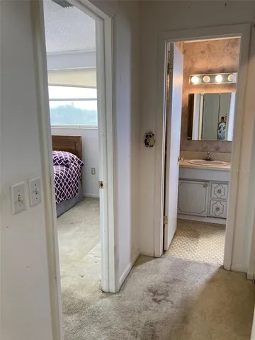 a view of room with a bathroom sink and mirror