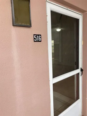 a view of a swimming pool with a patio and a yard
