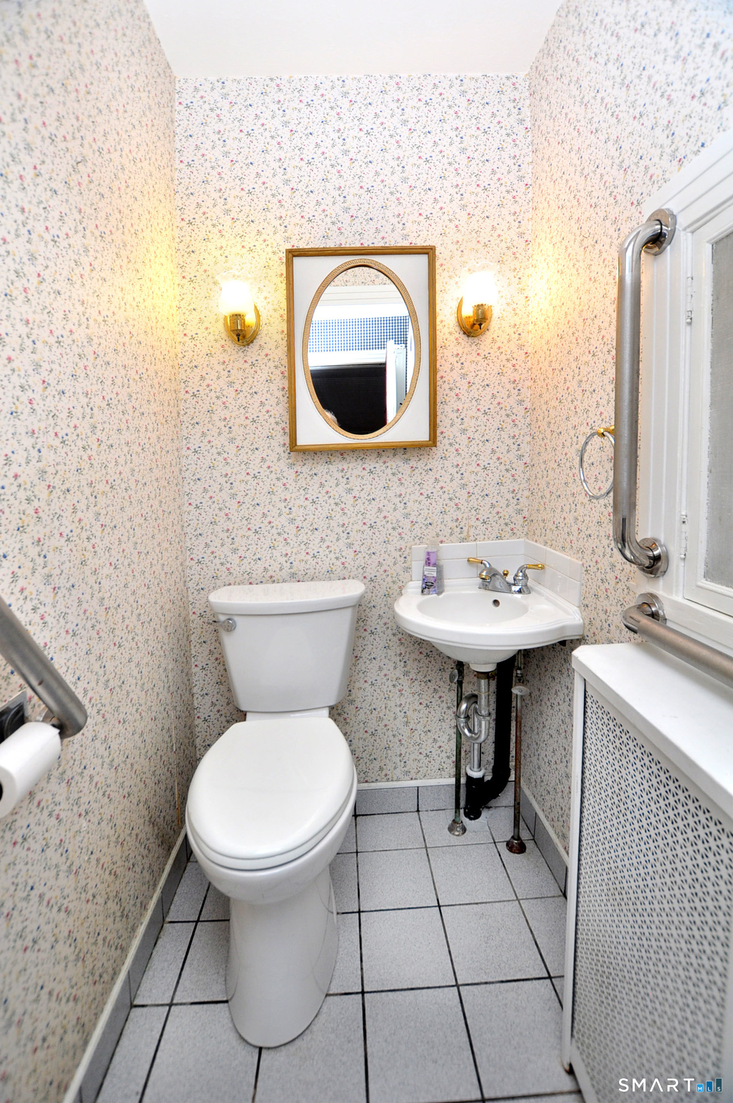10 Harvey Road Windsor, CT 06095 - Photo 14 of 36 a bathroom with a toilet sink and mirror