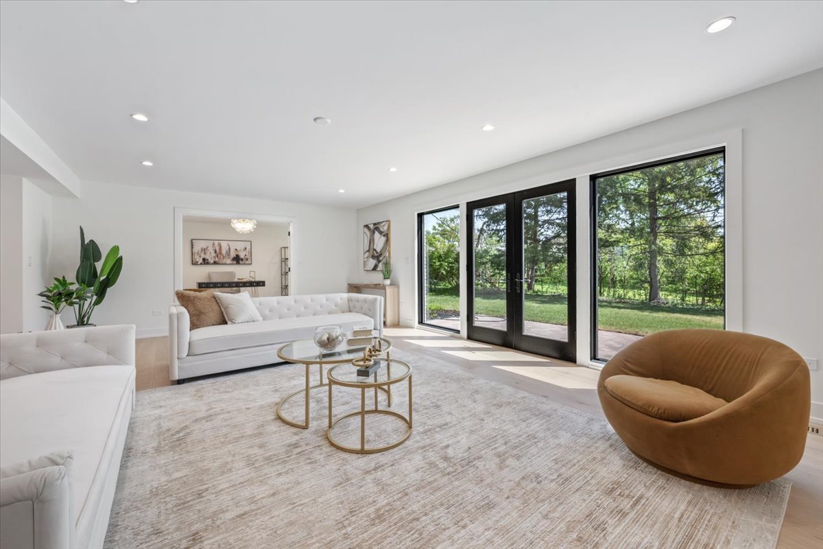 1975 Sunset Ridge Road Northfield, IL 60093 - Photo 11 of 53 a living room with furniture and a large window