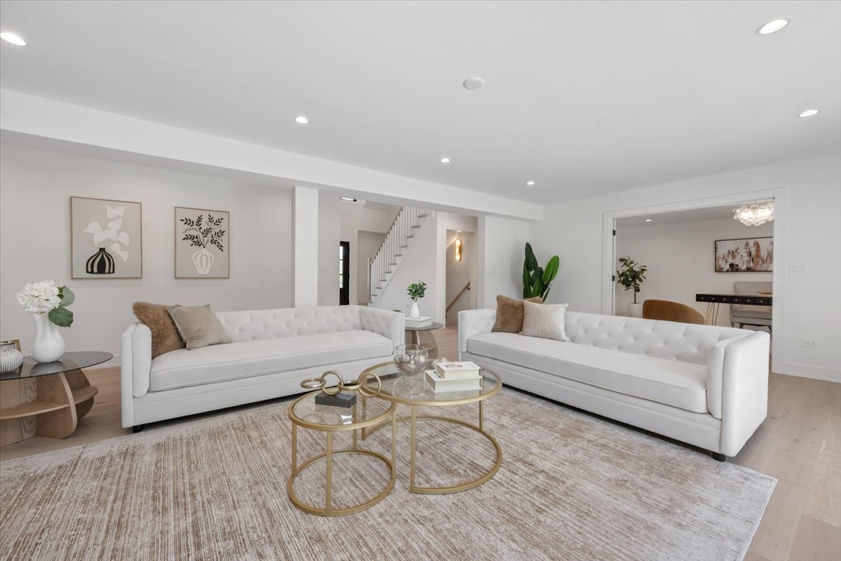 1975 Sunset Ridge Road Northfield, IL 60093 - Photo 12 of 53 a living room with furniture a wooden floor and white walls