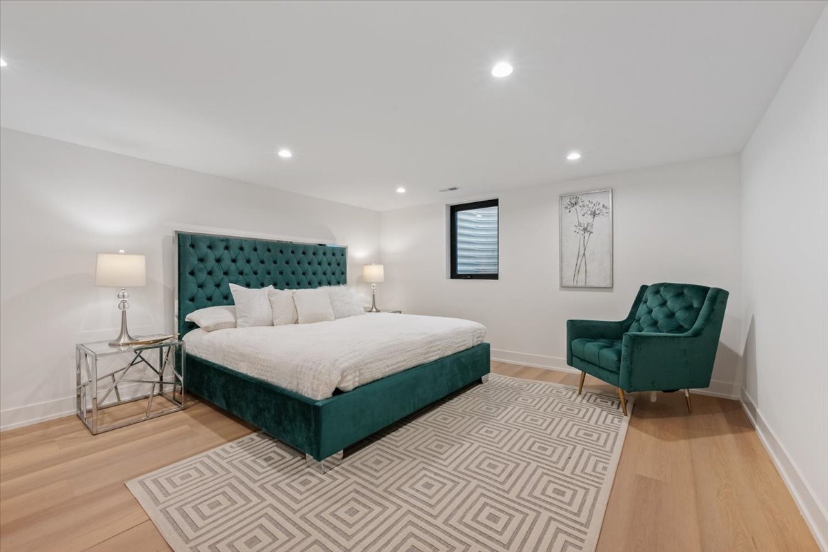 1975 Sunset Ridge Road Northfield, IL 60093 - Photo 38 of 53 a spacious bedroom with a bed and a sink