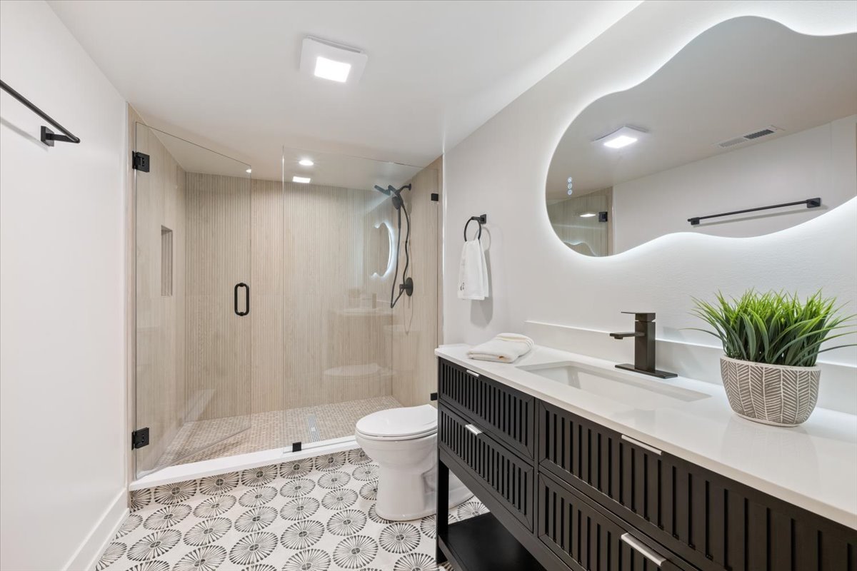 1975 Sunset Ridge Road Northfield, IL 60093 - Photo 39 of 53 a bathroom with a sink a toilet and shower