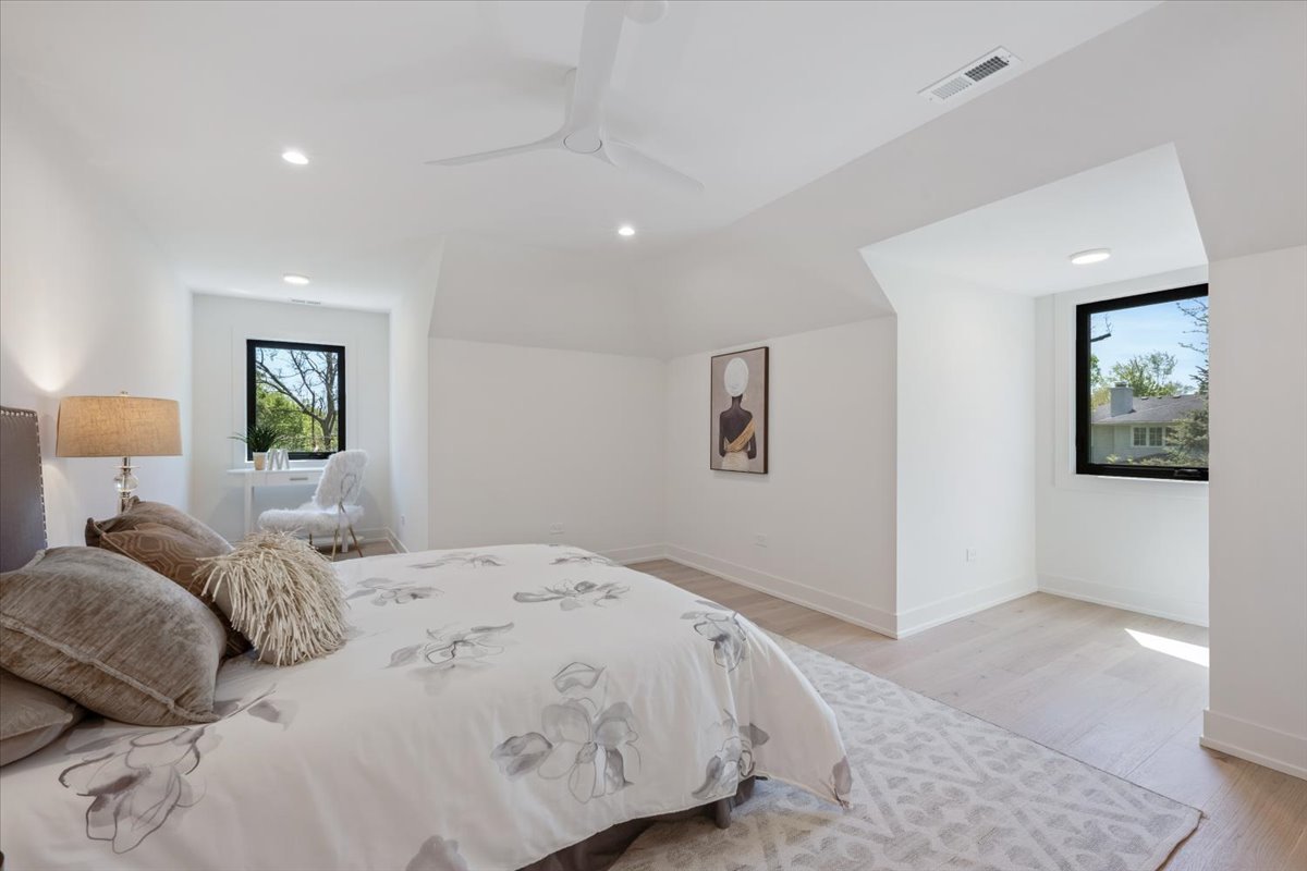 1975 Sunset Ridge Road Northfield, IL 60093 - Photo 49 of 53 a bedroom with a large bed and a painting on the wall