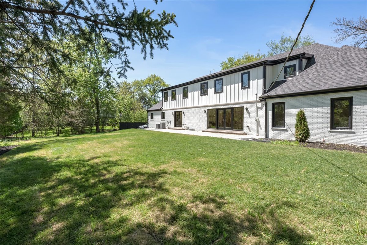 1975 Sunset Ridge Road Northfield, IL 60093 - Photo 53 of 53 a front view of a house with a garden