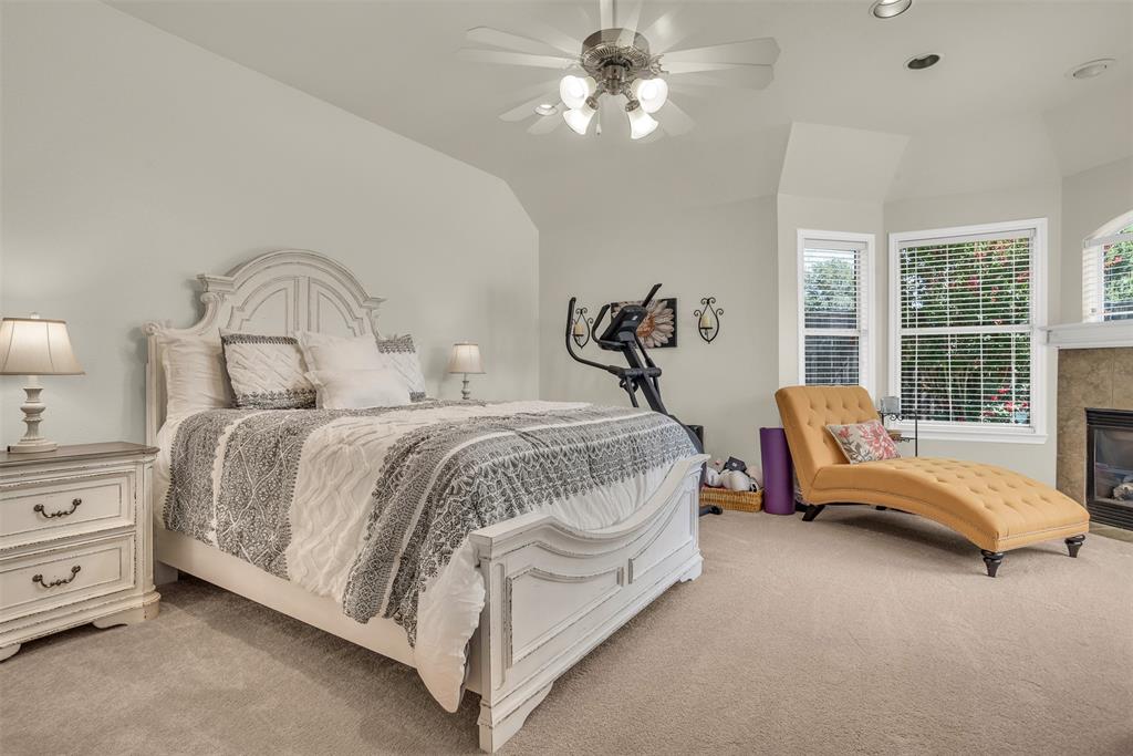 2309 Ranch House Drive Denton, TX 76210 - Photo 13 of 28 a bedroom with a bed and ceiling fan