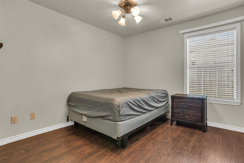 2309 Ranch House Drive Denton, TX 76210 - Photo 16 of 28 a room with a bed and a window
